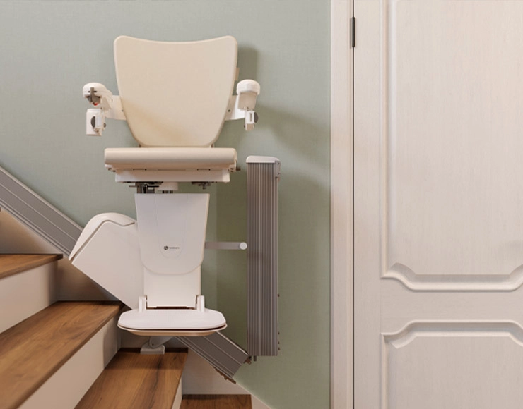 A Savaria stairlift on a home staircase