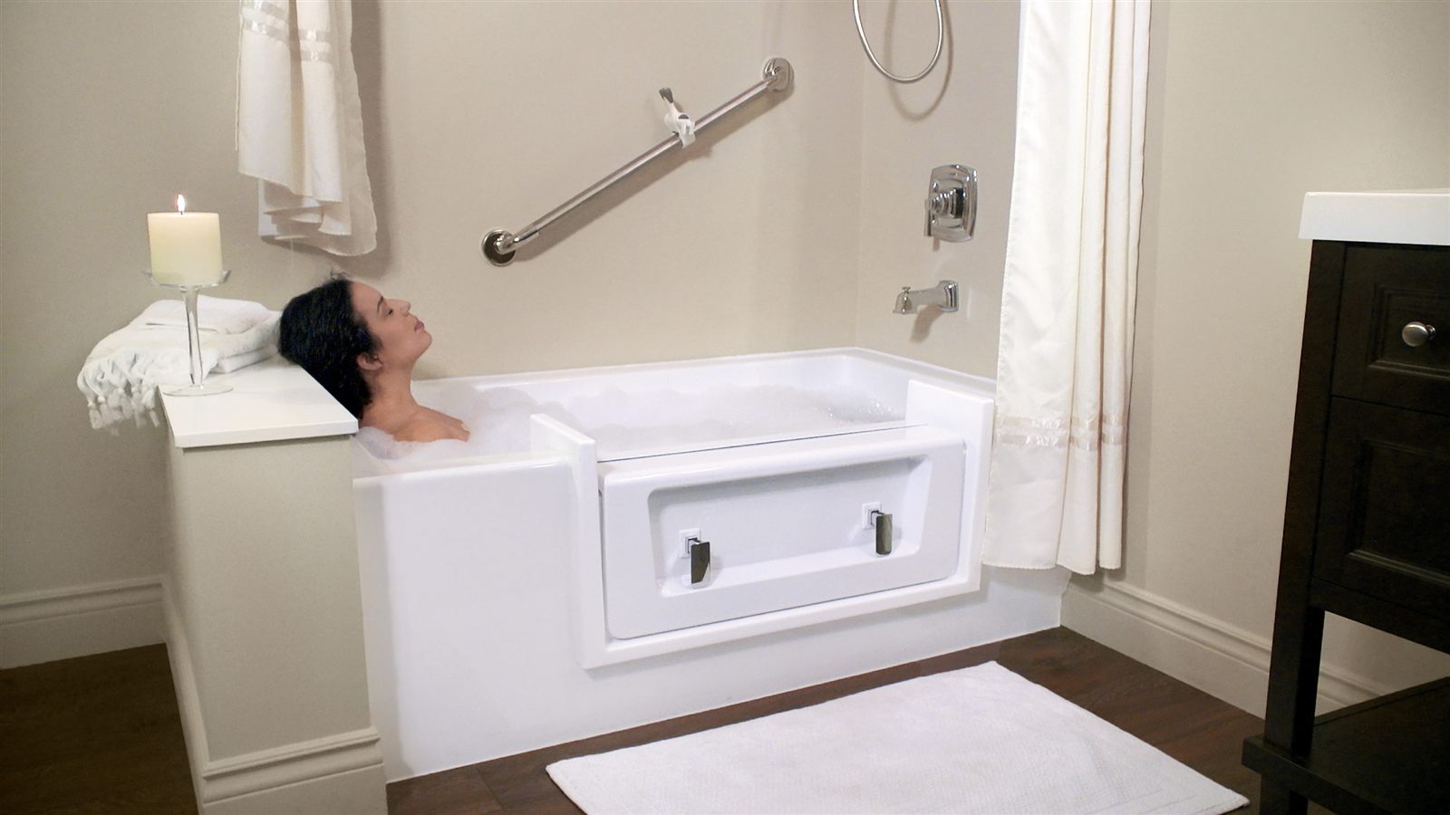 A woman relaxing in a full bubble bath with the cap in place